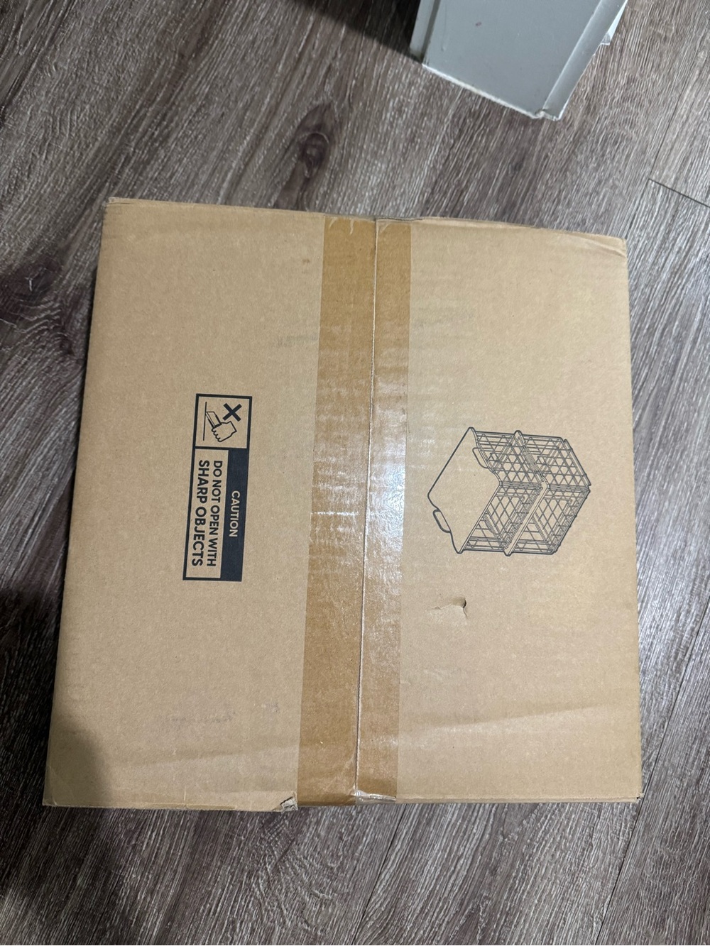 Unopened wire basket with wooden lid